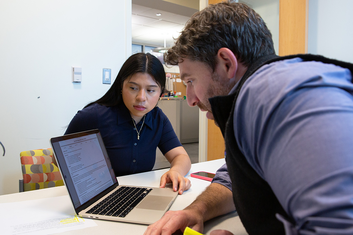 Advisor Matthew Donofrio meets with a student in his office.